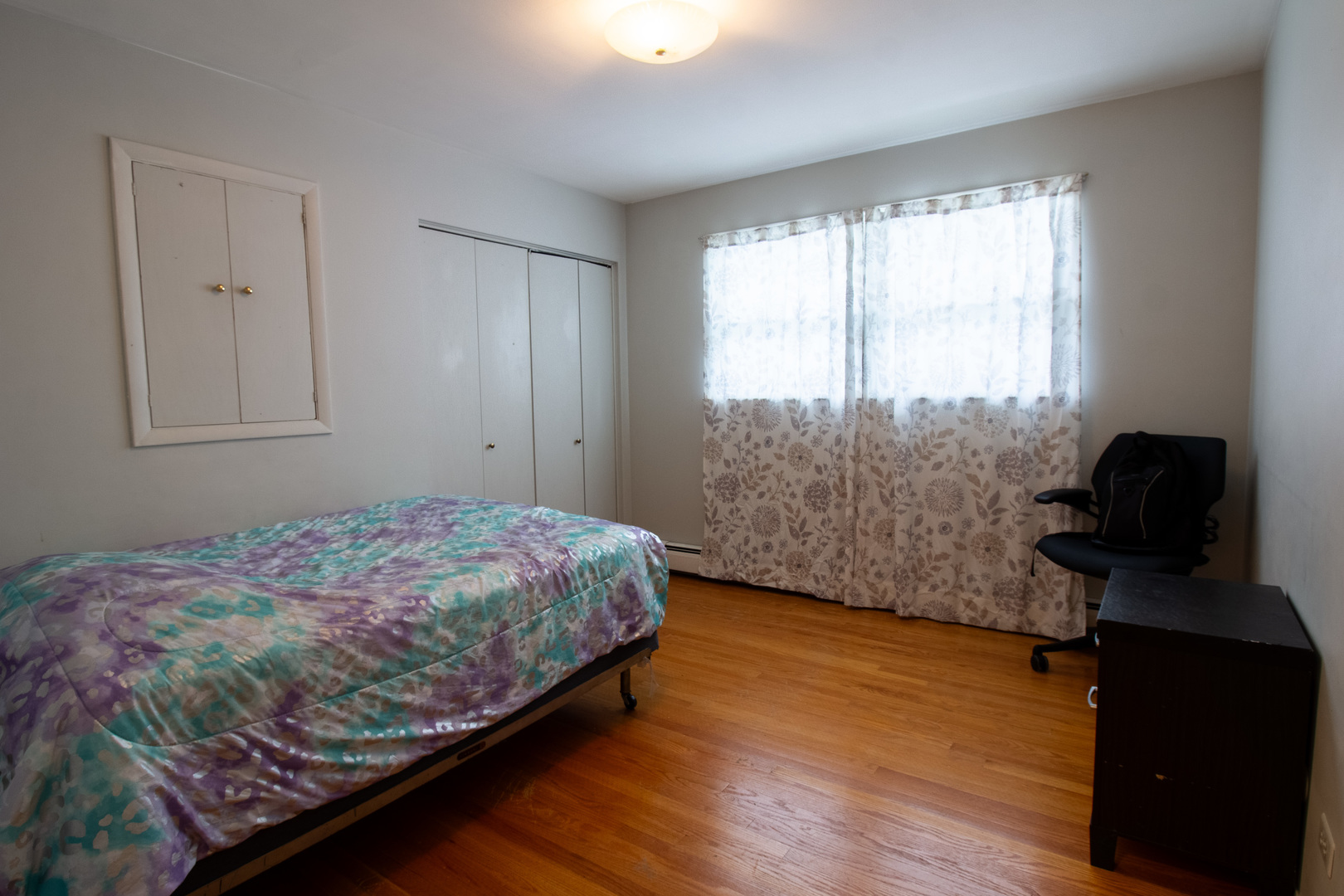 2737 Spruce Street River Grove, IL 60171 - Photo 21 of 30 a bedroom with a bed and wooden floor