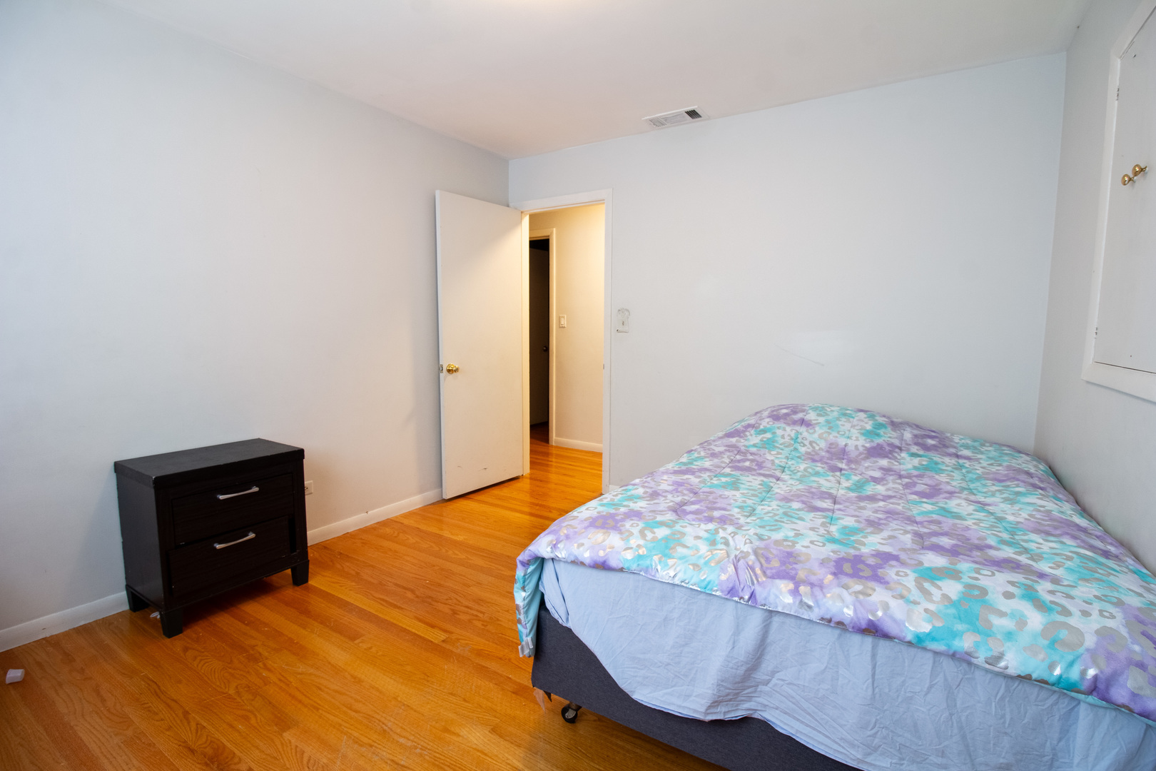 2737 Spruce Street River Grove, IL 60171 - Photo 22 of 30 a bedroom with a bed and a lamp