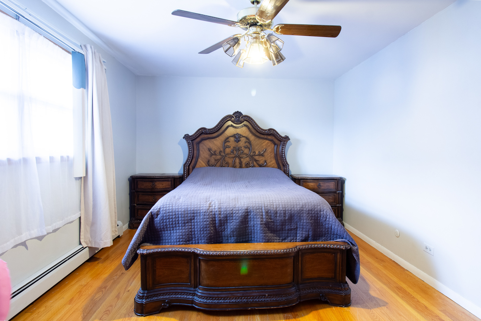 2737 Spruce Street River Grove, IL 60171 - Photo 24 of 30 a bed sitting in a bedroom next to a window