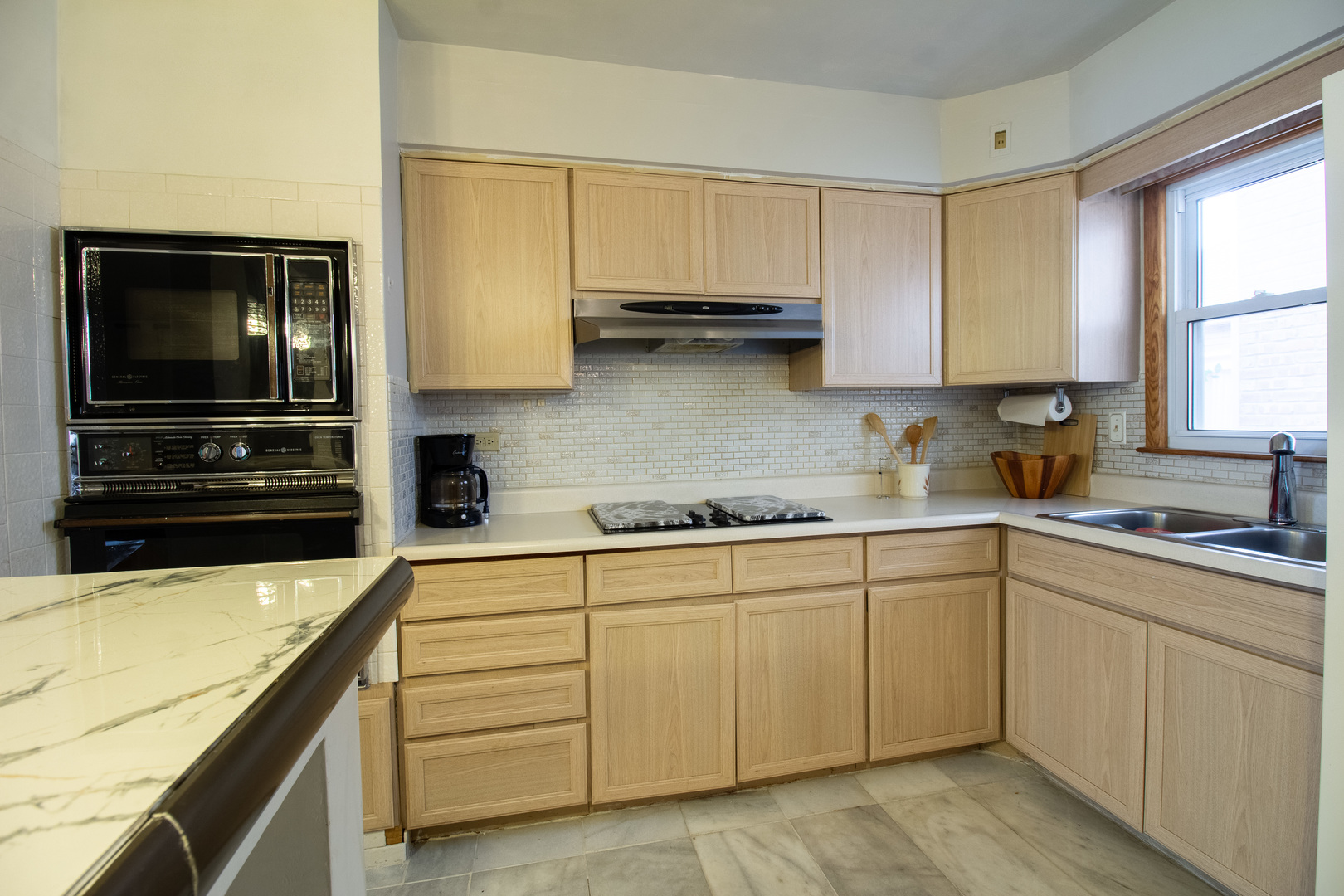 2737 Spruce Street River Grove, IL 60171 - Photo 7 of 30 a kitchen with white cabinets stainless steel appliances and window