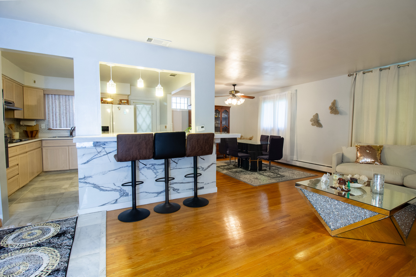 2737 Spruce Street River Grove, IL 60171 - Photo 8 of 30 a living room with furniture a large window and kitchen view