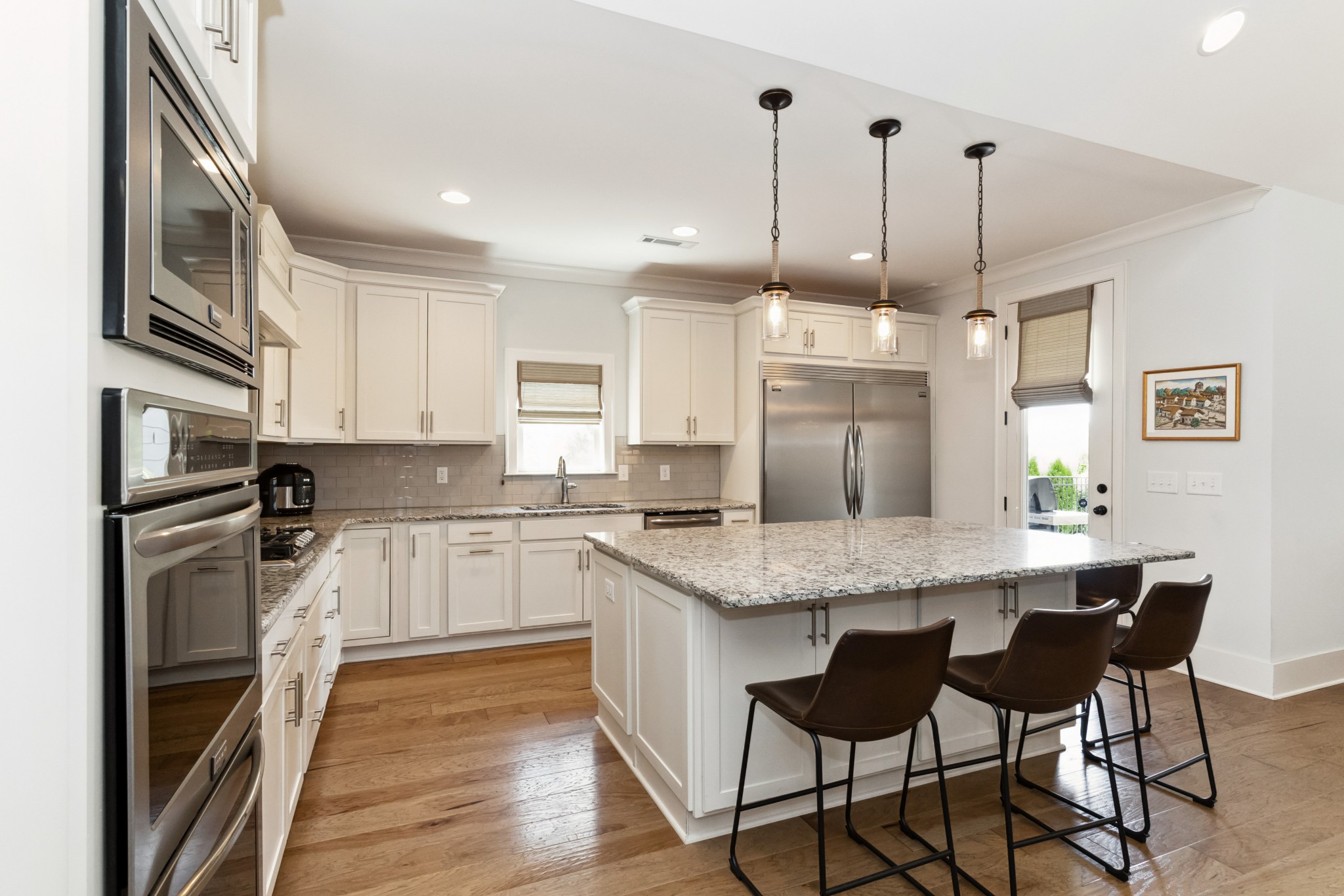 114 Vanner Road Mount Juliet, TN 37122 - Photo 13 of 39 a kitchen with stainless steel appliances granite countertop a kitchen island hardwood floor sink and stove