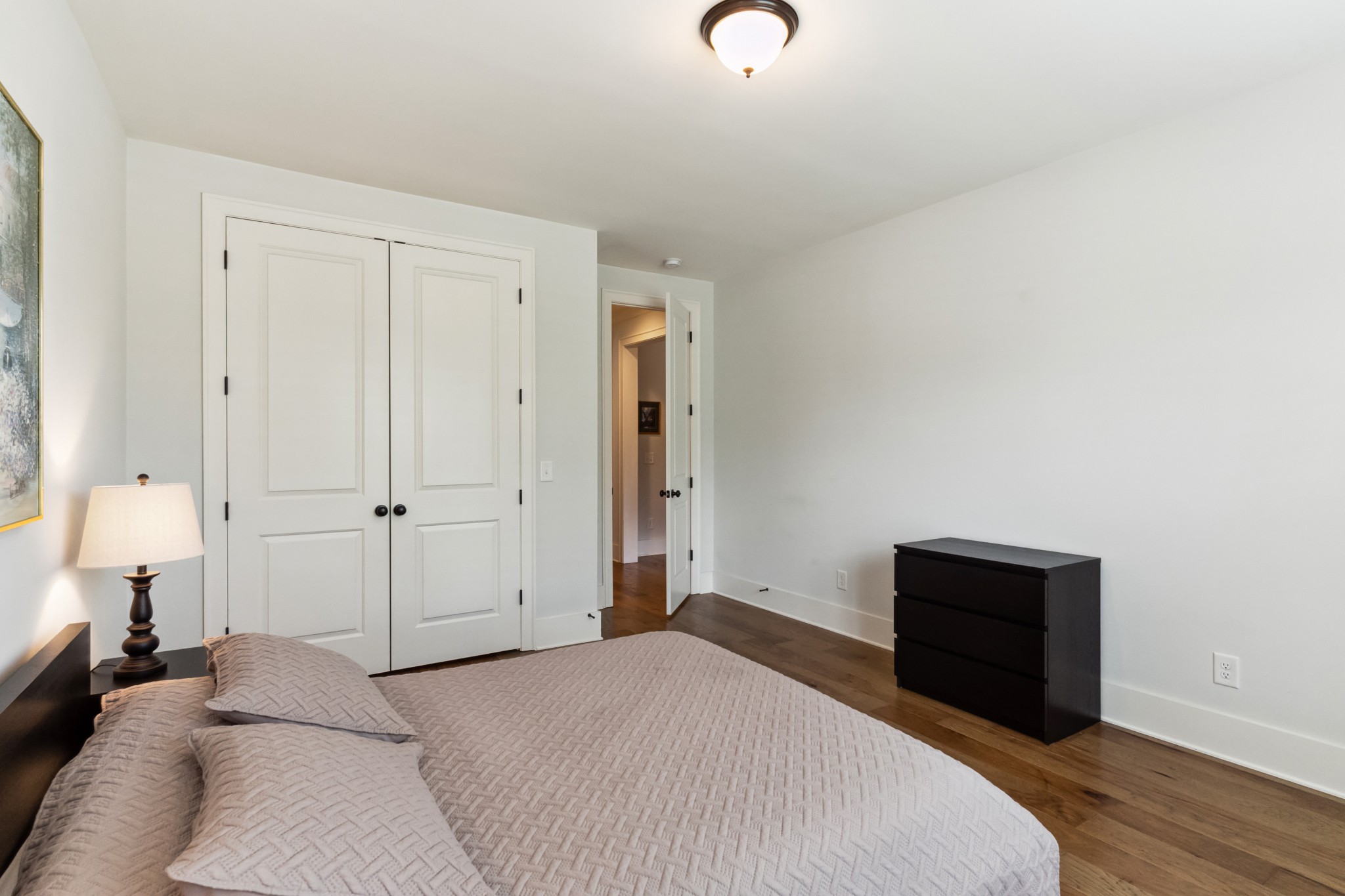 114 Vanner Road Mount Juliet, TN 37122 - Photo 17 of 39 a bedroom with a bed and a lamp