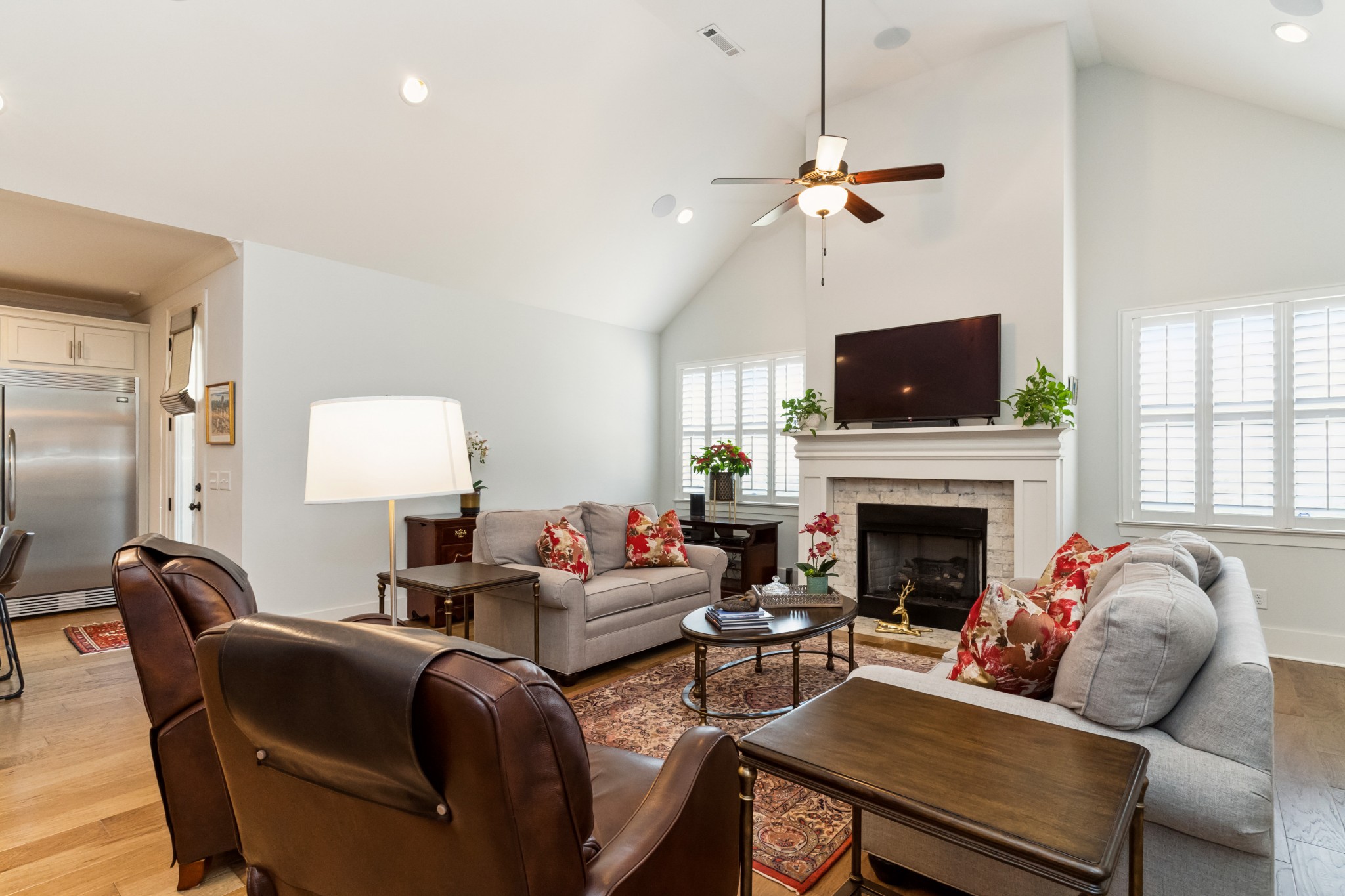 114 Vanner Road Mount Juliet, TN 37122 - Photo 9 of 39 a living room with furniture a flat screen tv and a fireplace