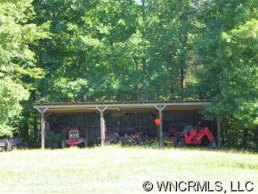 232 Long Road Bostic, NC 28018 - Photo 4 of 12 a view of a barn in the middle of a yard