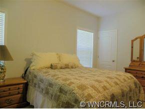 232 Long Road Bostic, NC 28018 - Photo 7 of 12 a bed sitting in a bedroom next to a window