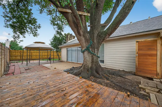 a house with a tree in the background