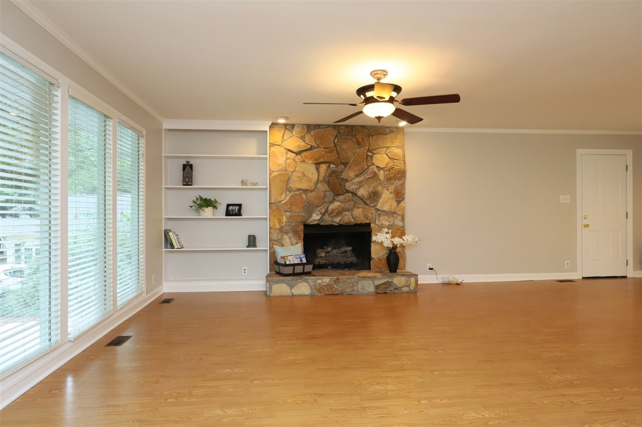4101 Stranaver Place Raleigh, NC 27612 - Photo 4 of 27 Enjoy the gas log fireplace with stone masonry hearth. Large windows offer loads of natural light. Living Room