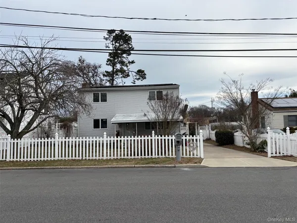 a view of a house with a street