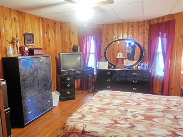 38 Whitman Street Chicopee, MA 01013 - Photo 5 of 15 a bedroom with a bed and a bathroom