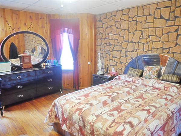 38 Whitman Street Chicopee, MA 01013 - Photo 6 of 15 a bedroom with a bed and a dresser