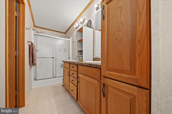 a bathroom with a shower and a sink