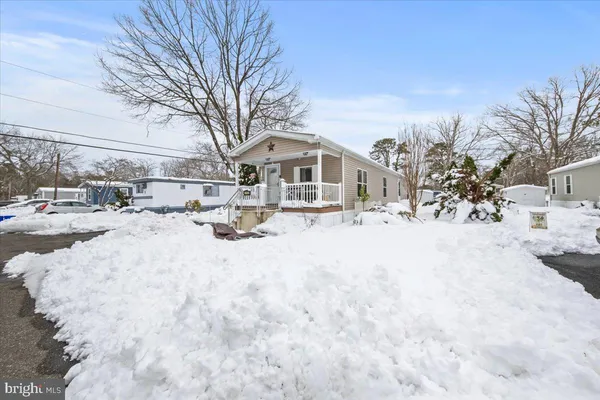 a view of snow on the side of road