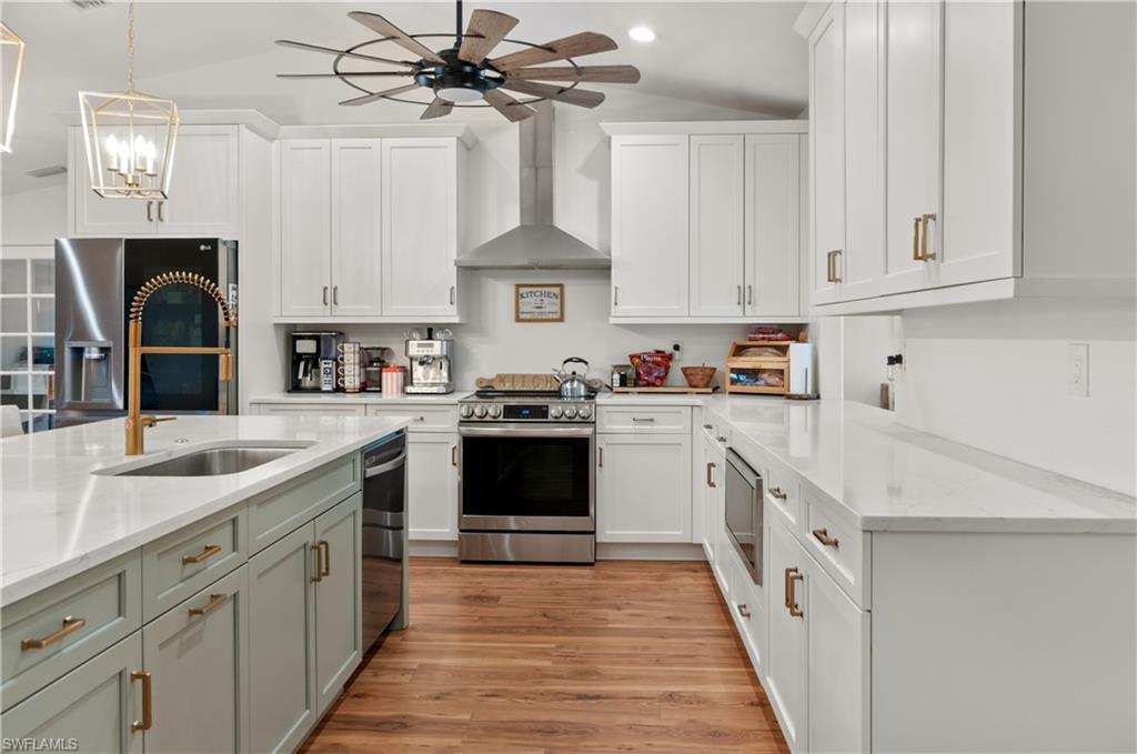 13308 Island Road Fort Myers, FL 33905 - Photo 9 of 39 a kitchen with cabinets a sink and appliances