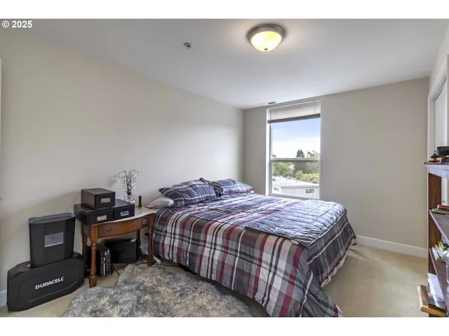 a bedroom with a bed and a tv