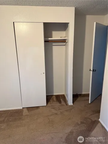 a room with a cabinet and cabinets
