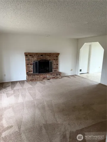 a living room with a fireplace