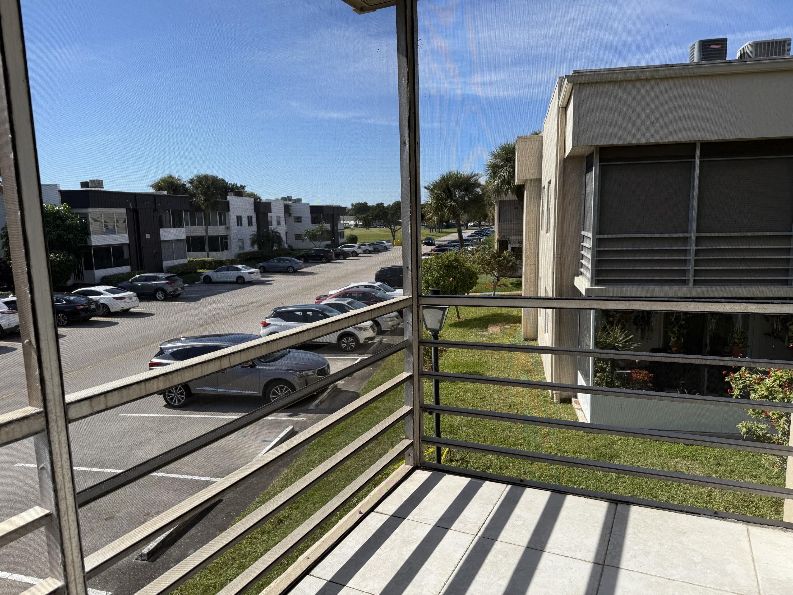 855 Normandy Trail, Unit 855 Delray Beach, FL 33484 - Photo 13 of 14 SCREENED PORCH