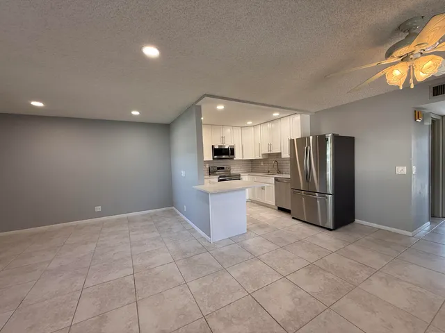 a kitchen with a stove and a microwave