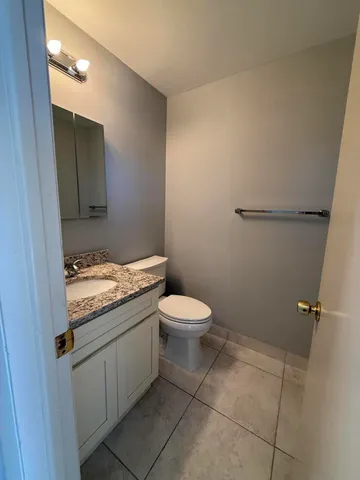 a kitchen with stainless steel appliances a refrigerator and a stove top oven