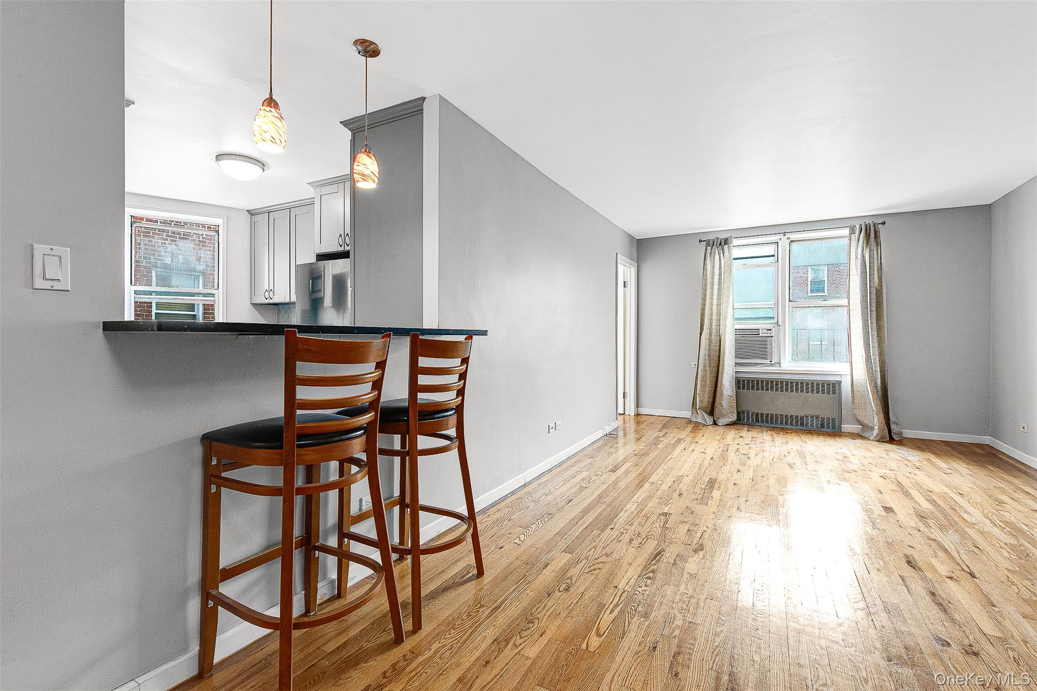 67-30 Clyde Street, Unit 6W Queens, NY 11375 - Photo 10 of 32 a view of a workspace with furniture and window