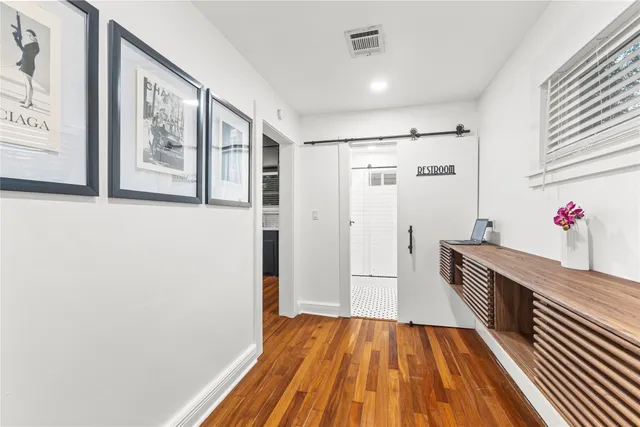 a kitchen with stainless steel appliances kitchen island granite countertop a sink and cabinets