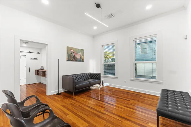 a work space with wooden floor and a window