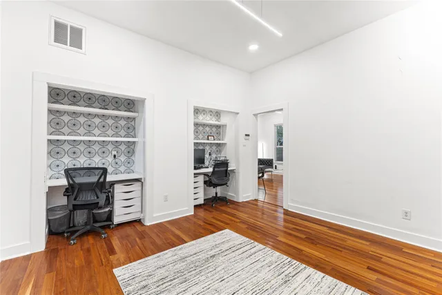 a bathroom with a sink a mirror and shower