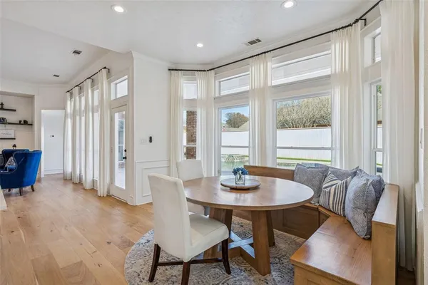 a view of a dining room with furniture and window