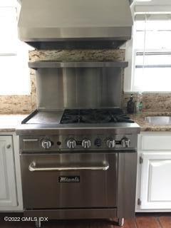 12 Old Post Road Cos Cob, CT 06830 - Photo 12 of 34 a stove top oven sitting inside of a kitchen
