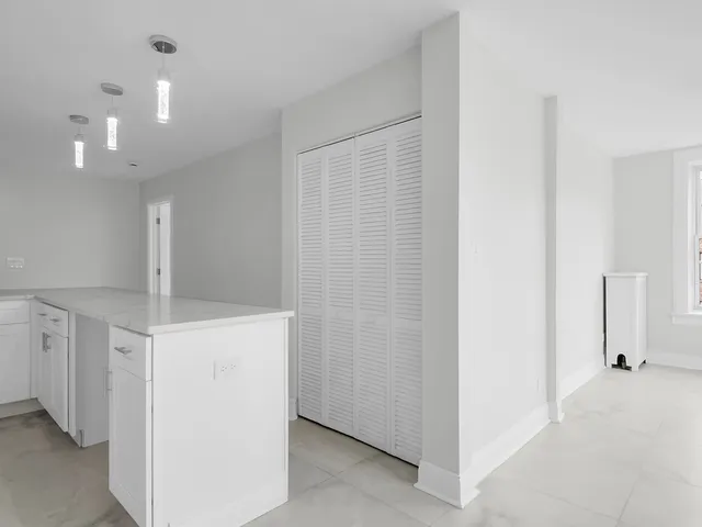 a view of a hallway with closet