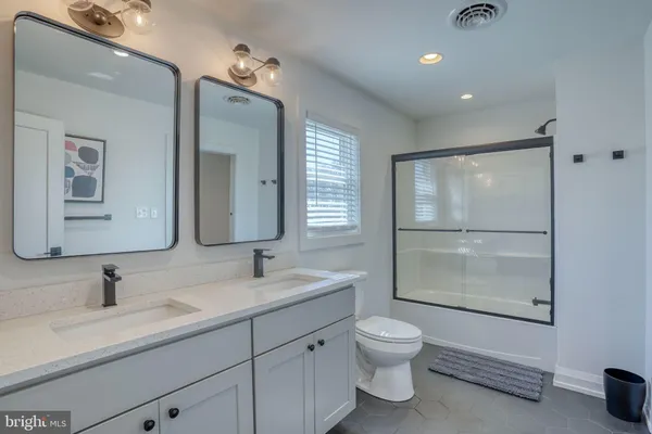 an aerial view of a houses with a yard