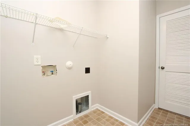 a view of a livingroom with table and chair