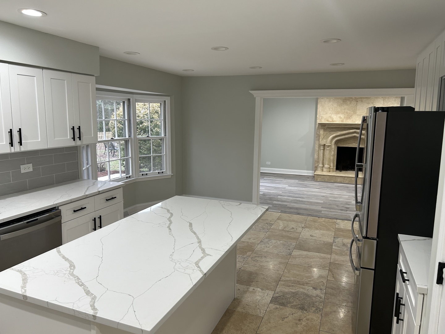 Undisclosed Address Naperville, IL 60563 - Photo 13 of 43 a large white kitchen with granite countertop a refrigerator and a sink