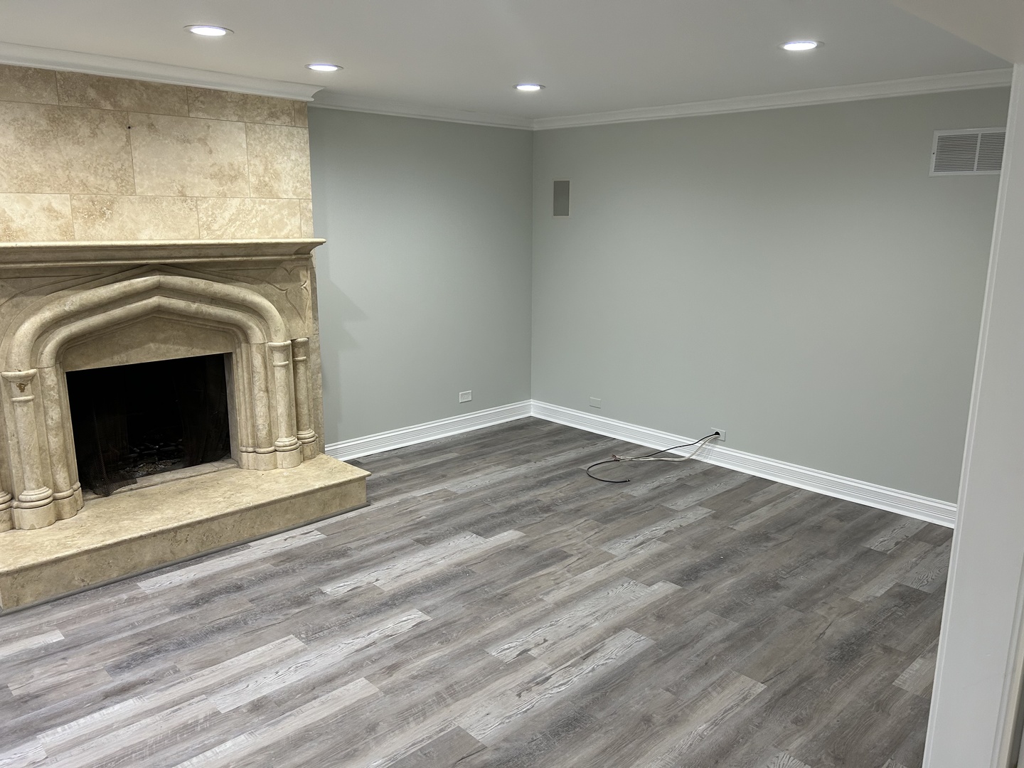 Undisclosed Address Naperville, IL 60563 - Photo 15 of 43 a view of empty room with wooden floor and fireplace
