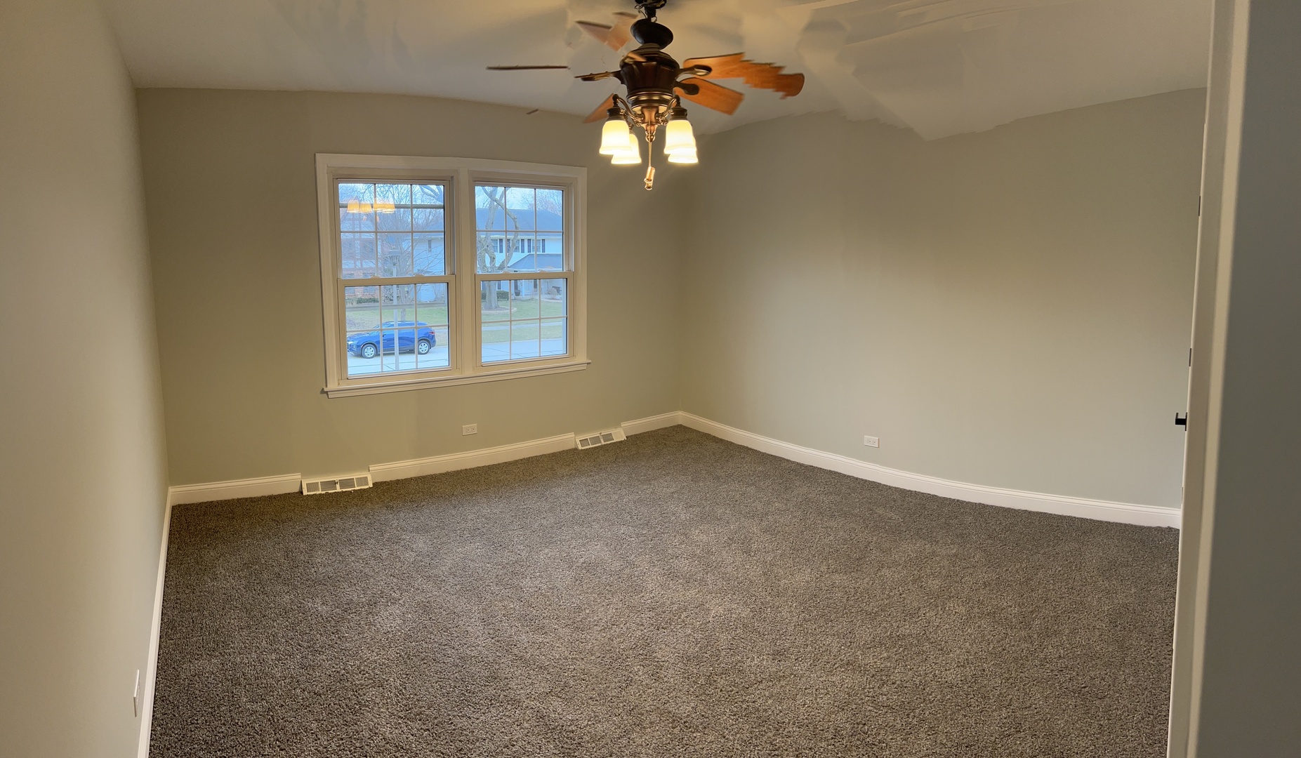 Undisclosed Address Naperville, IL 60563 - Photo 26 of 43 an empty room with a window and a fan