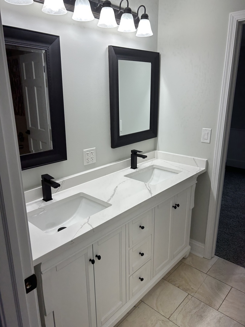 Undisclosed Address Naperville, IL 60563 - Photo 31 of 43 a bathroom with a double vanity sink and mirror
