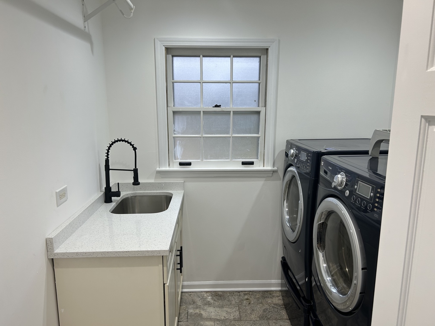 Undisclosed Address Naperville, IL 60563 - Photo 33 of 43 a view of a kitchen with a sink and a washer dryer