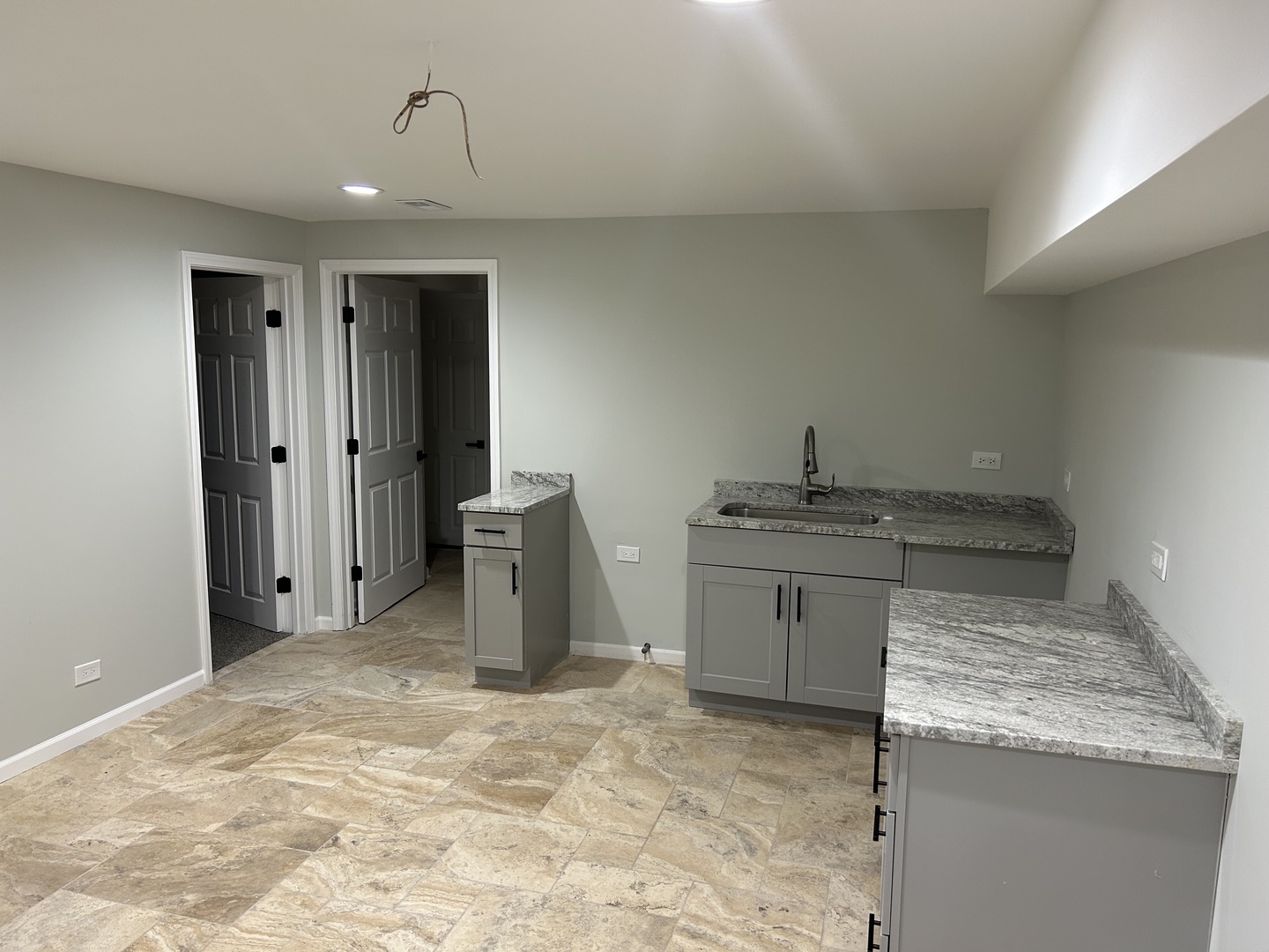 Undisclosed Address Naperville, IL 60563 - Photo 36 of 43 a kitchen with granite countertop a sink and a stove top oven