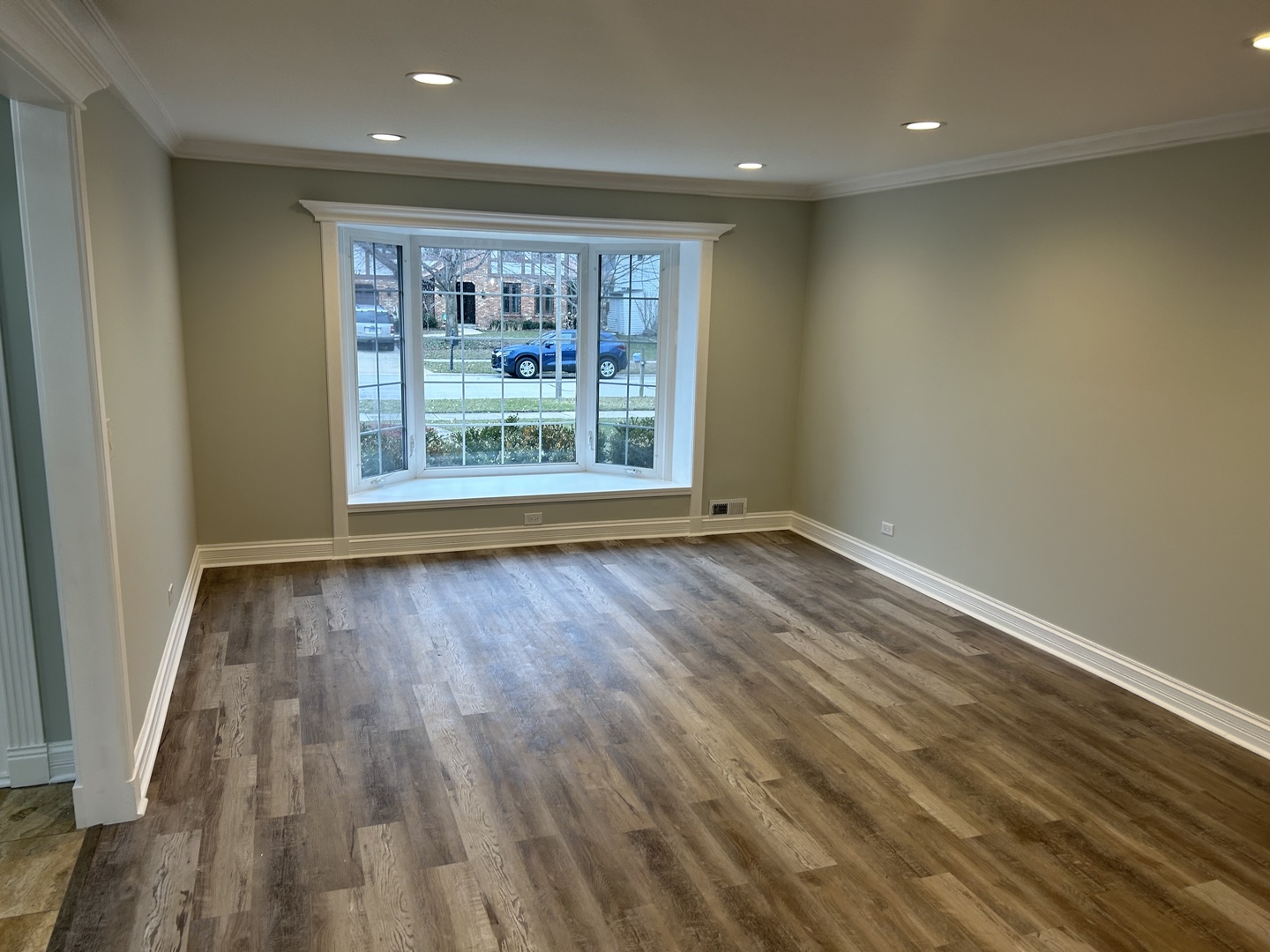 Undisclosed Address Naperville, IL 60563 - Photo 4 of 43 a view of an empty room with wooden floor and a window