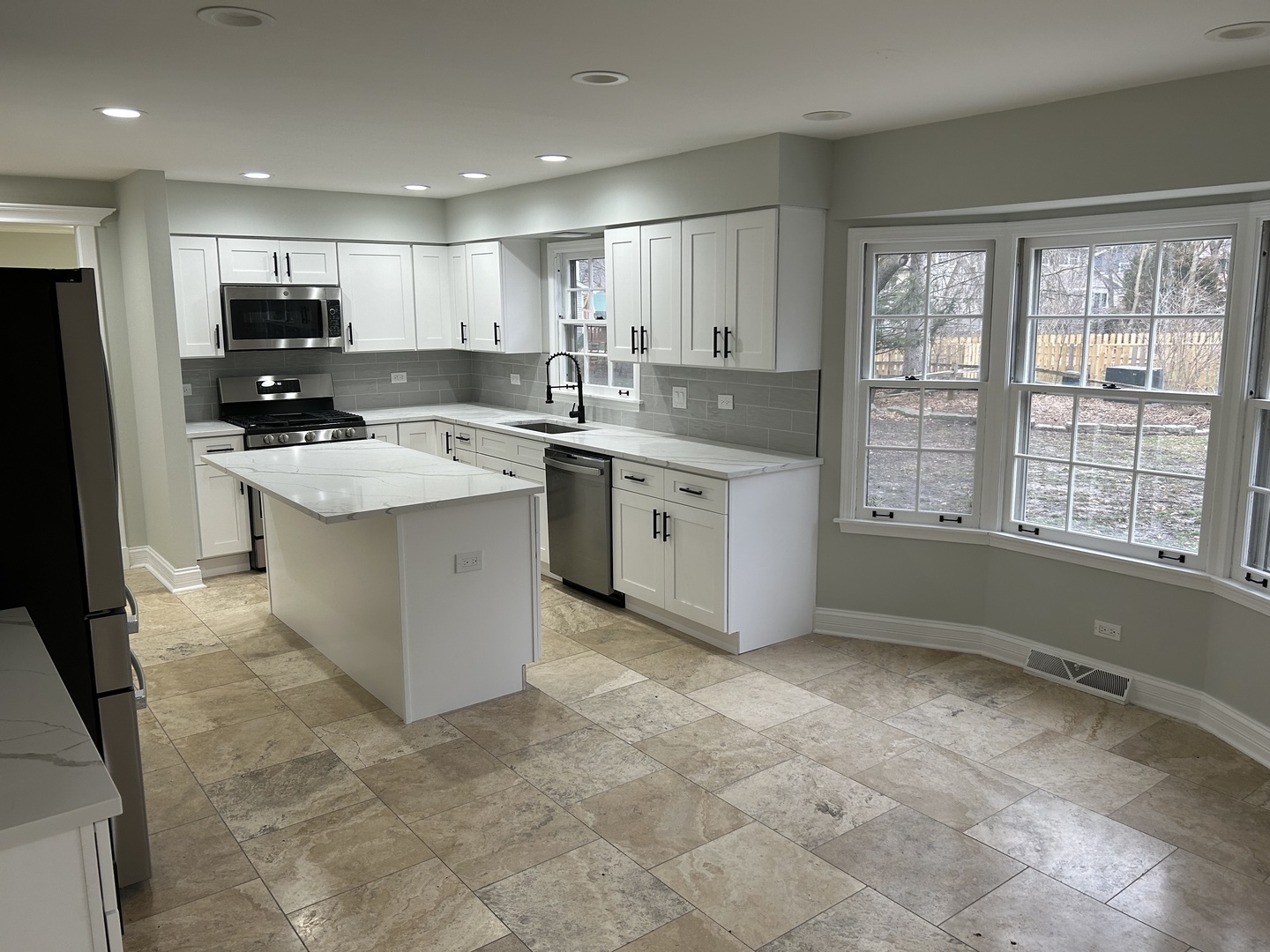 Undisclosed Address Naperville, IL 60563 - Photo 7 of 43 a large kitchen with kitchen island a sink stainless steel appliances and cabinets