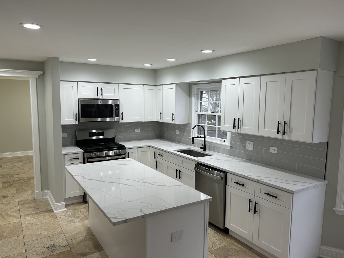Undisclosed Address Naperville, IL 60563 - Photo 8 of 43 a kitchen with sink a microwave and cabinets
