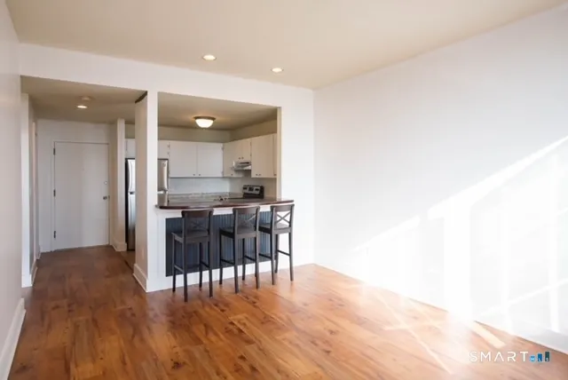 a kitchen with a table and chairs