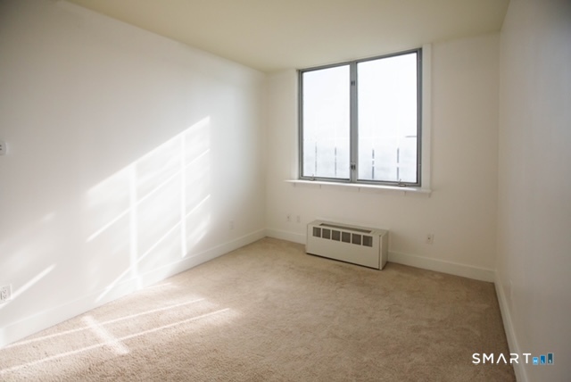 49 Day Street, Unit 404 Norwalk, CT 06854 - Photo 6 of 11 an empty room with a window