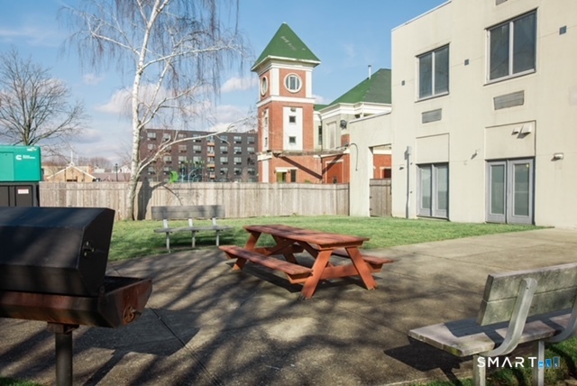 49 Day Street, Unit 404 Norwalk, CT 06854 - Photo 10 of 11 a front view of a building with outdoor seating