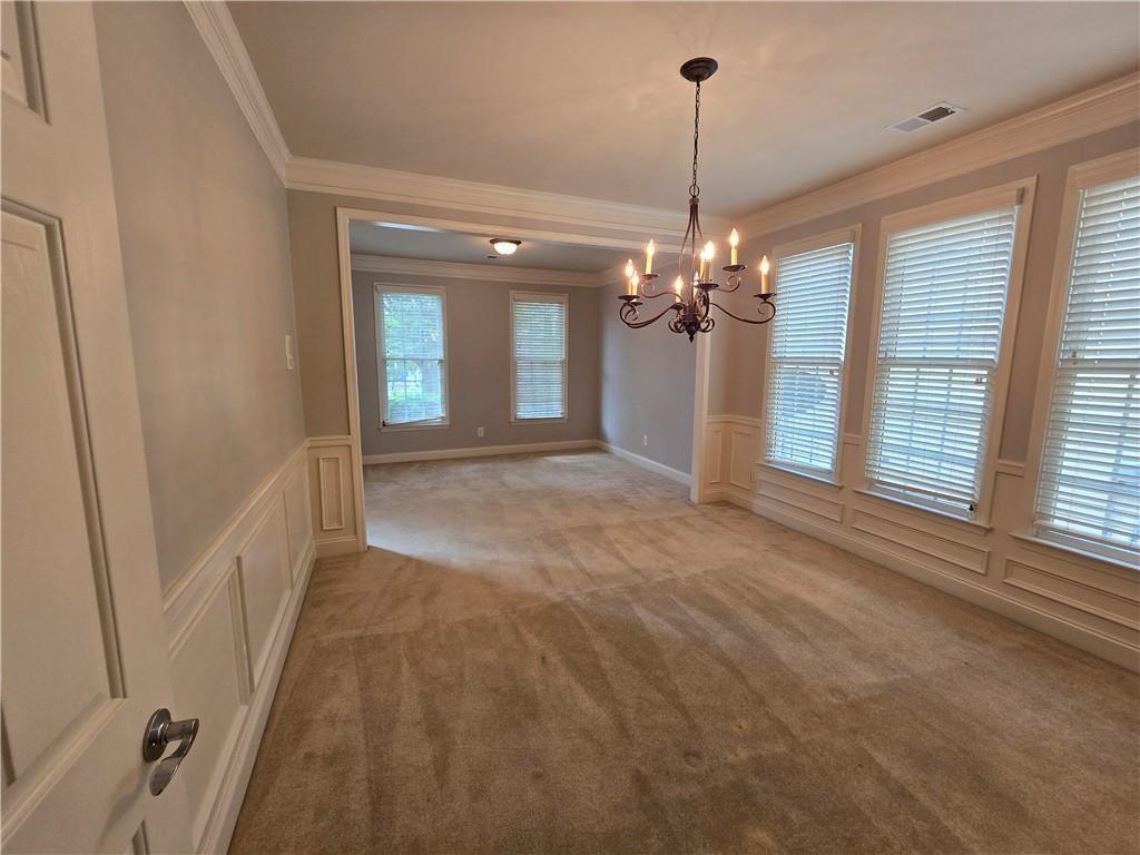 624 Maple Grove Way Marietta, GA 30066 - Photo 8 of 27 a view of a chandelier in big room with windows and chandelier
