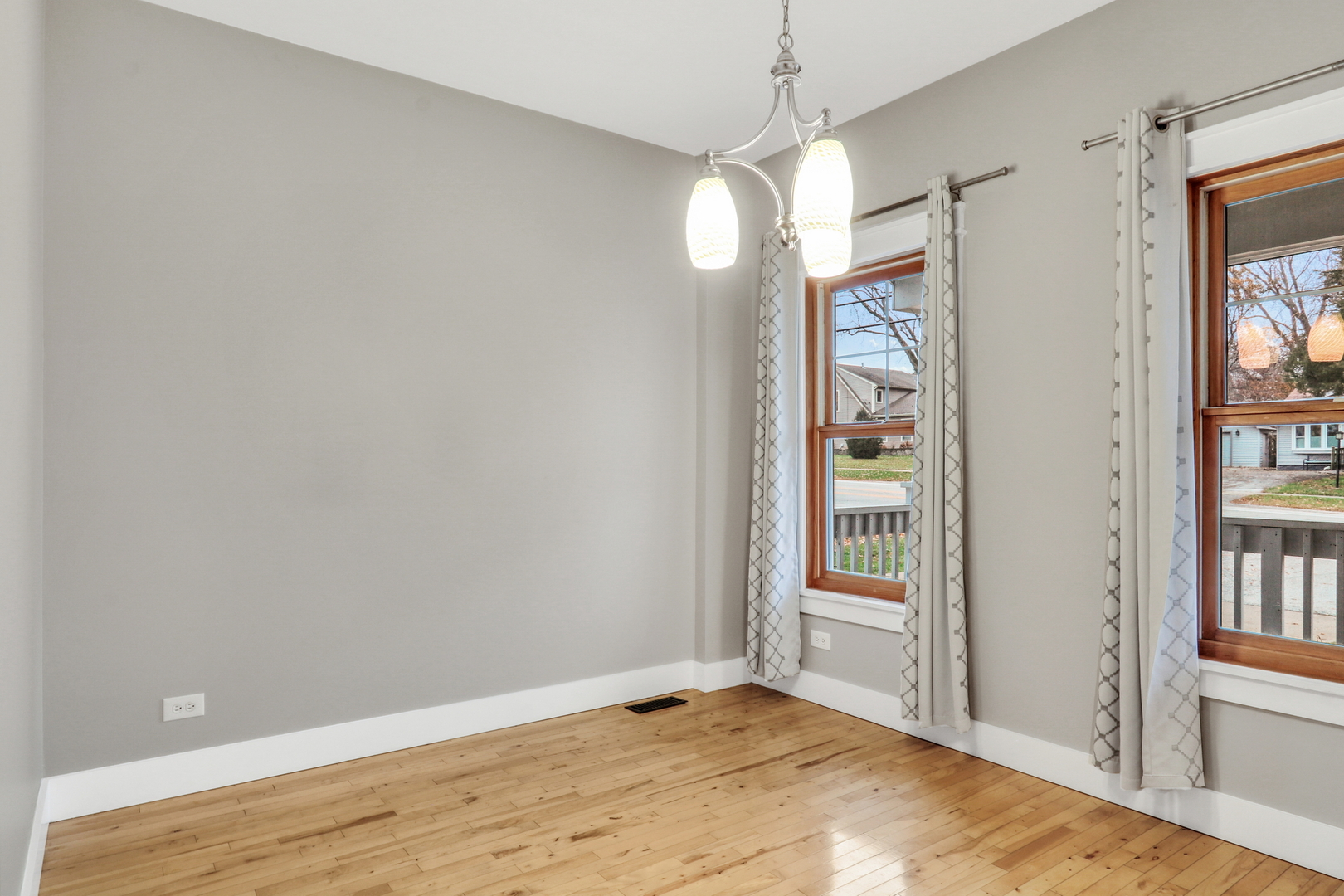 350 South Alleghany Road Grayslake, IL 60030 - Photo 21 of 54 a view of an empty room with window and wooden floor
