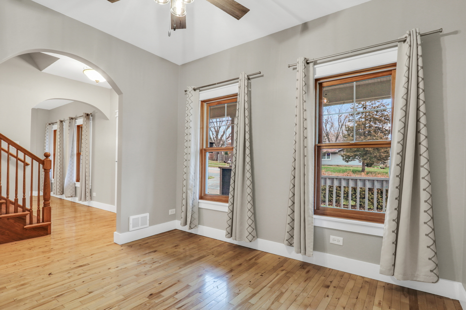 350 South Alleghany Road Grayslake, IL 60030 - Photo 22 of 54 an empty room with wooden floor fan and windows