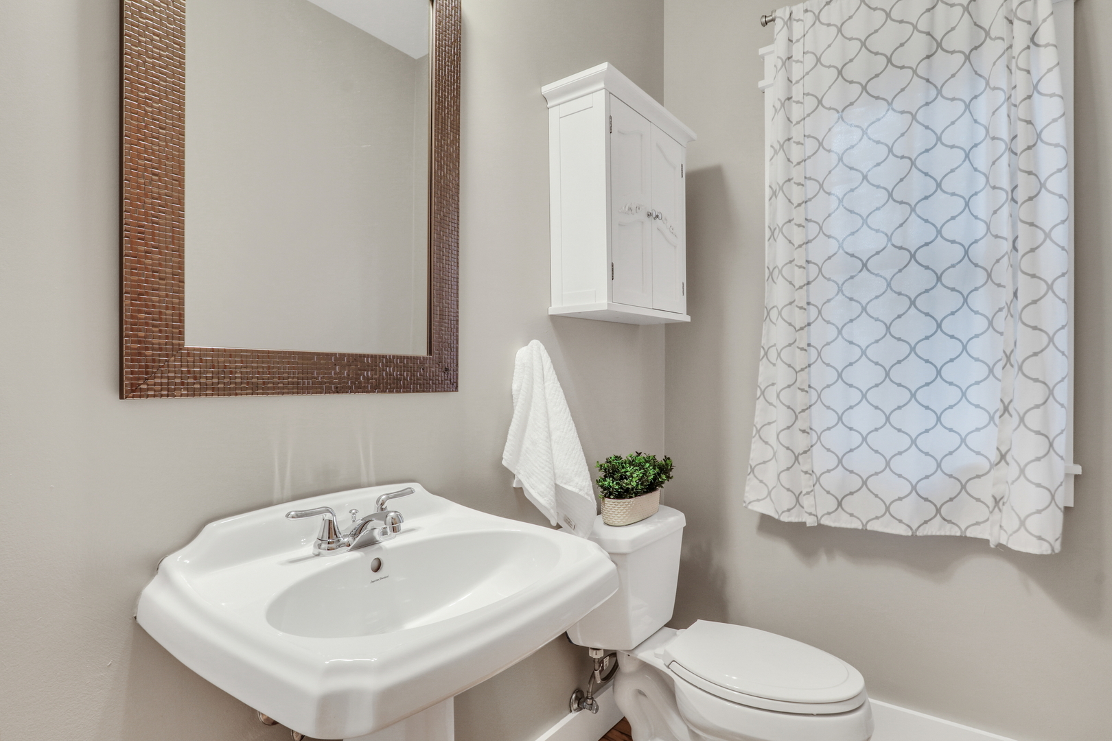 350 South Alleghany Road Grayslake, IL 60030 - Photo 27 of 54 a bathroom with a sink a toilet and mirror