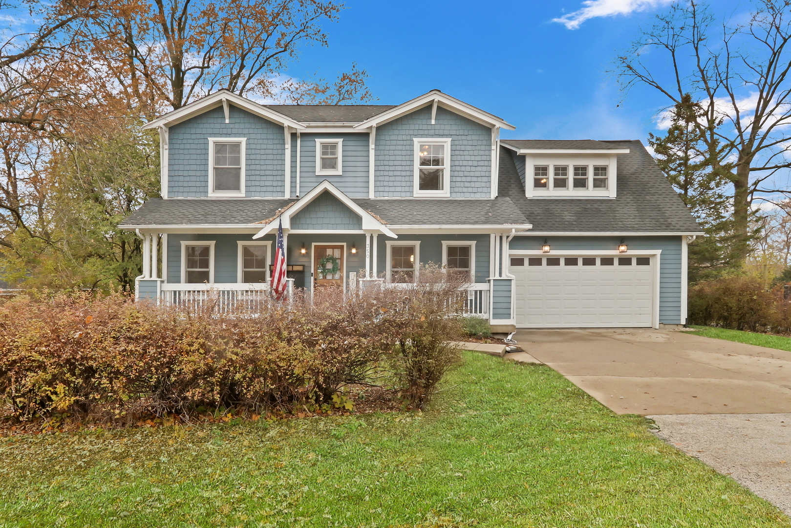 350 South Alleghany Road Grayslake, IL 60030 - Photo 49 of 54 a front view of a house with a garden and trees